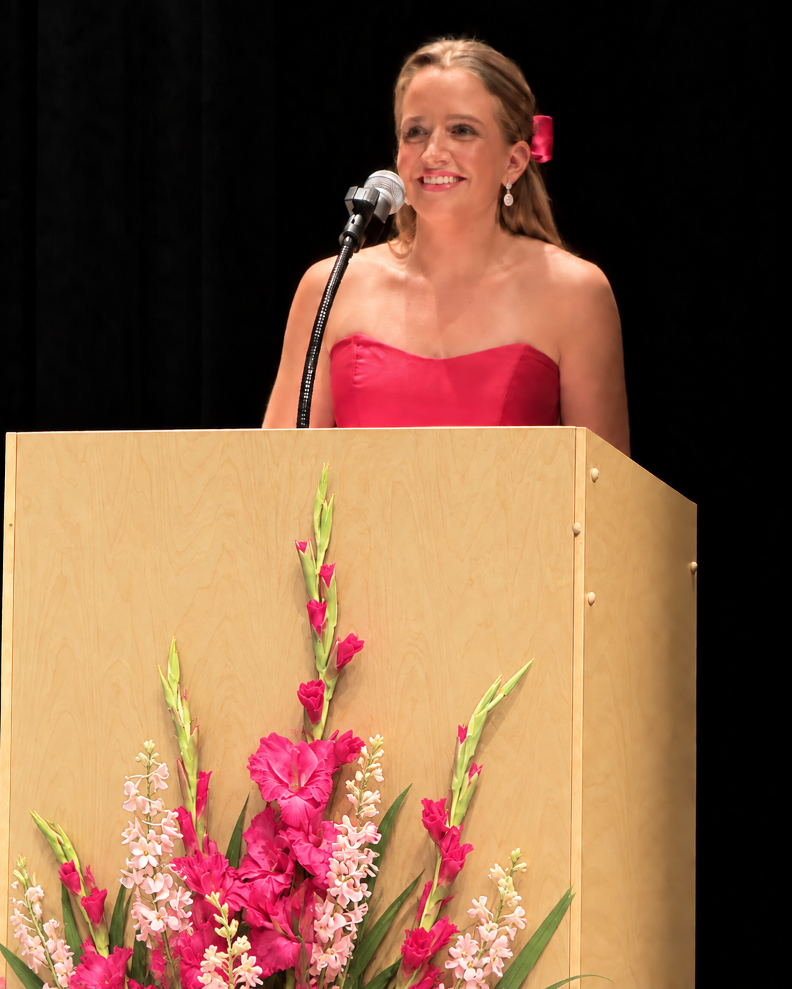 Sydney Ohlemann speaking at a podium during Distinguished Young Women